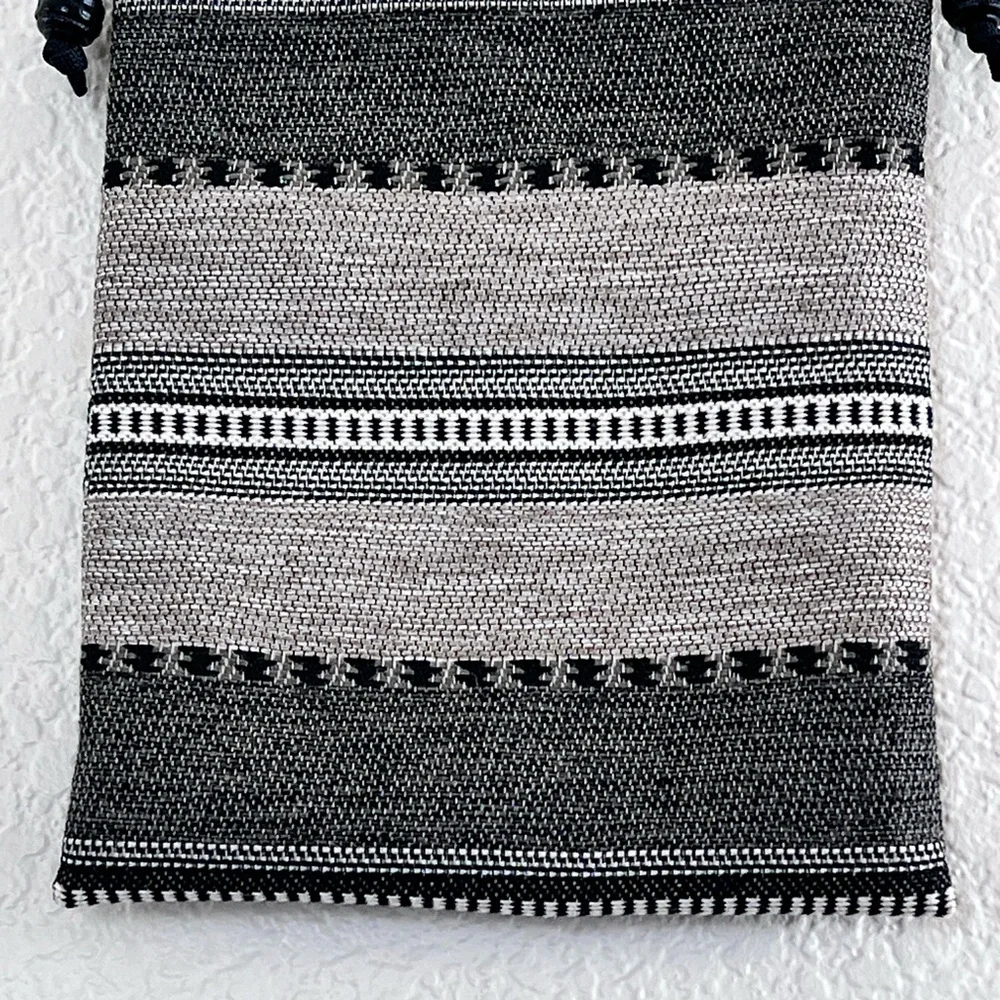 Like new black and white woven crossbody bag small